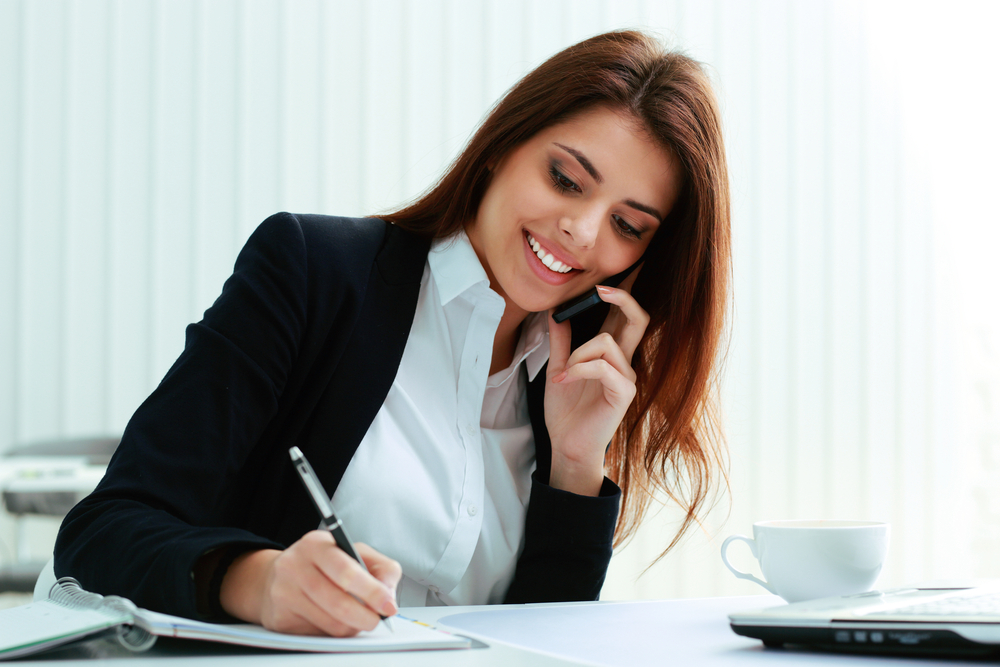 PRT Staffing Steps to Asking for a Perfect Job Reference Smiling Businesswoman on the Phone Taking Notes