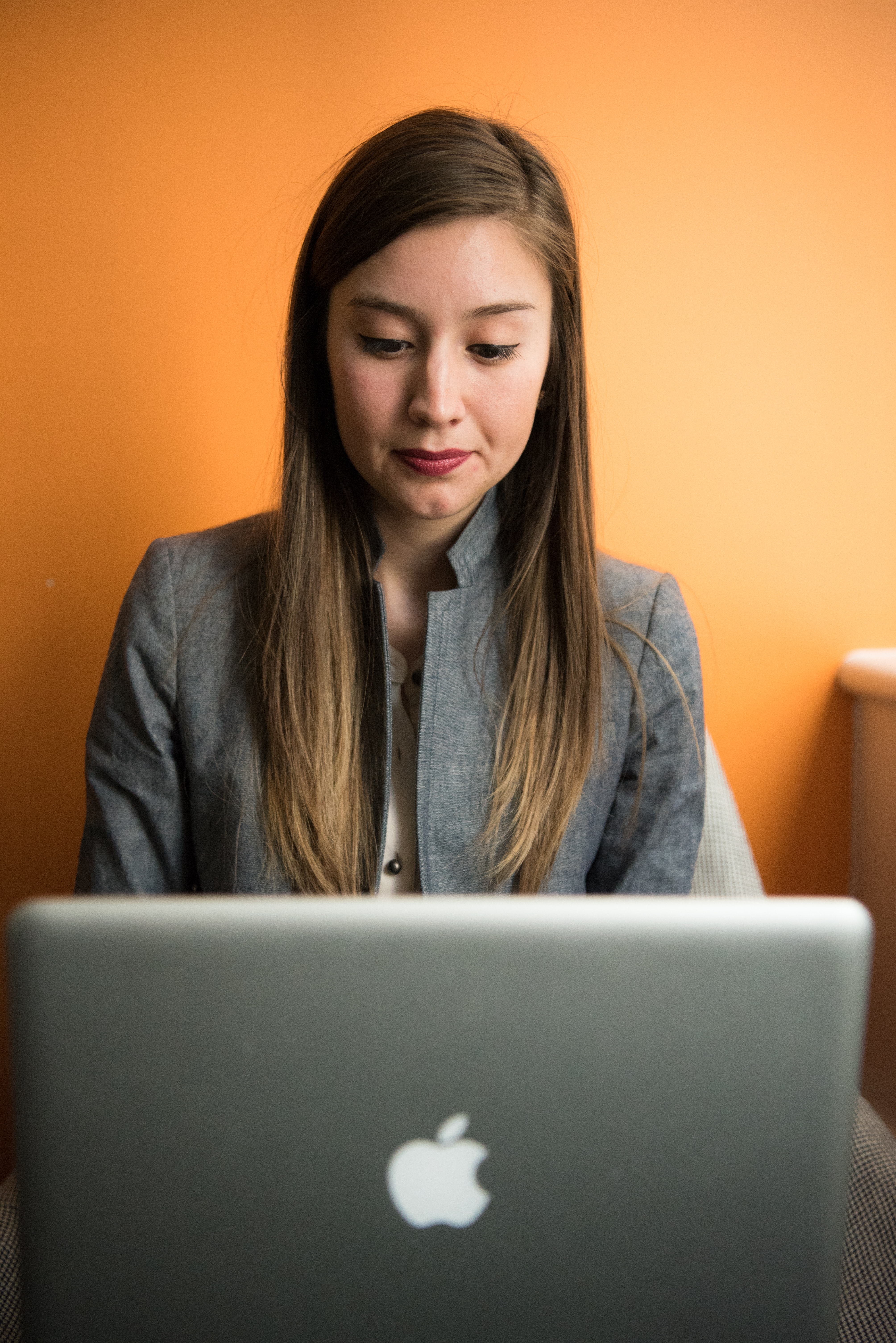 woman looking at her laptop