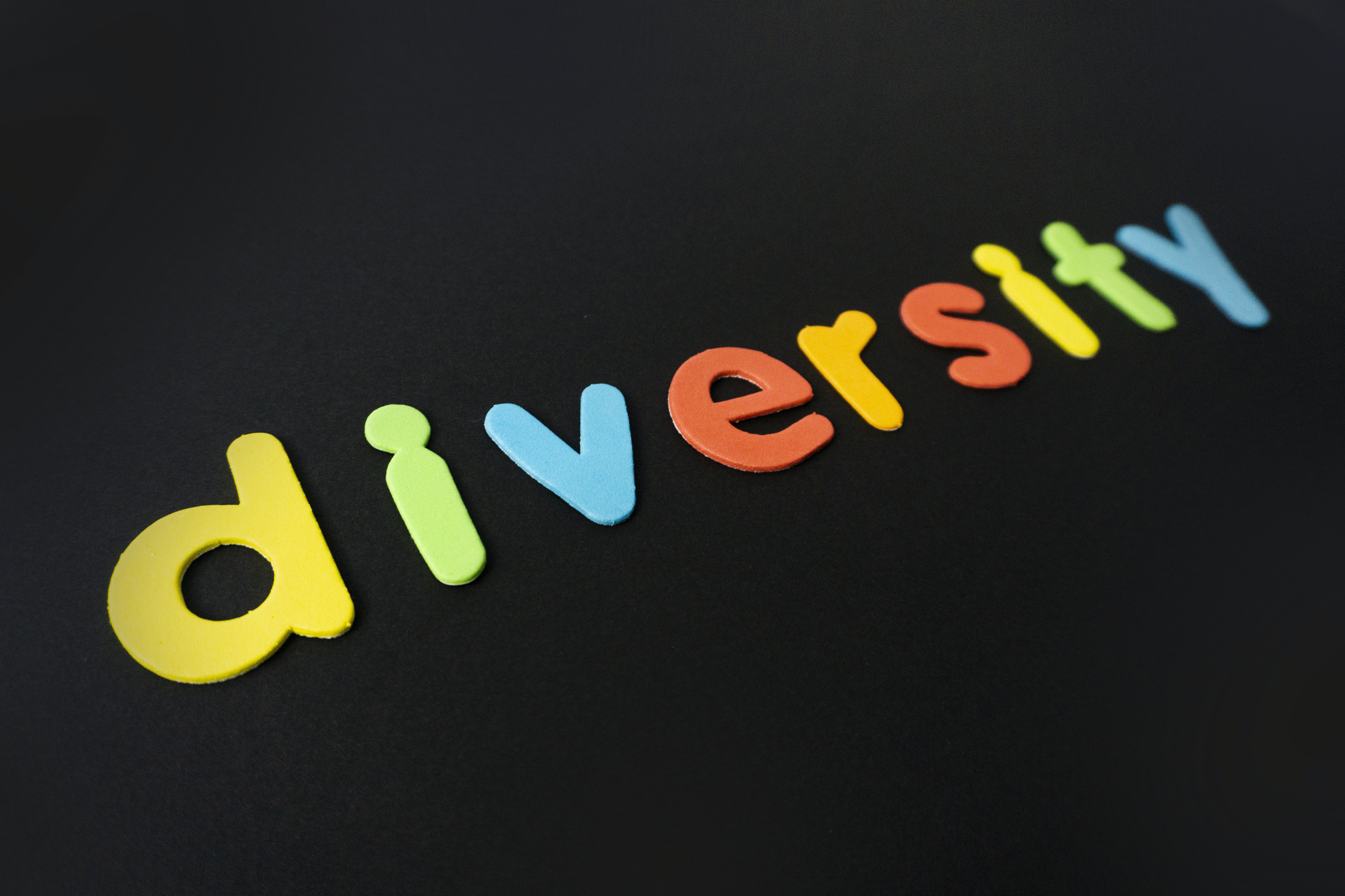 PRT Staffing Workplace diversity and inclusion word diversity in colors on black background