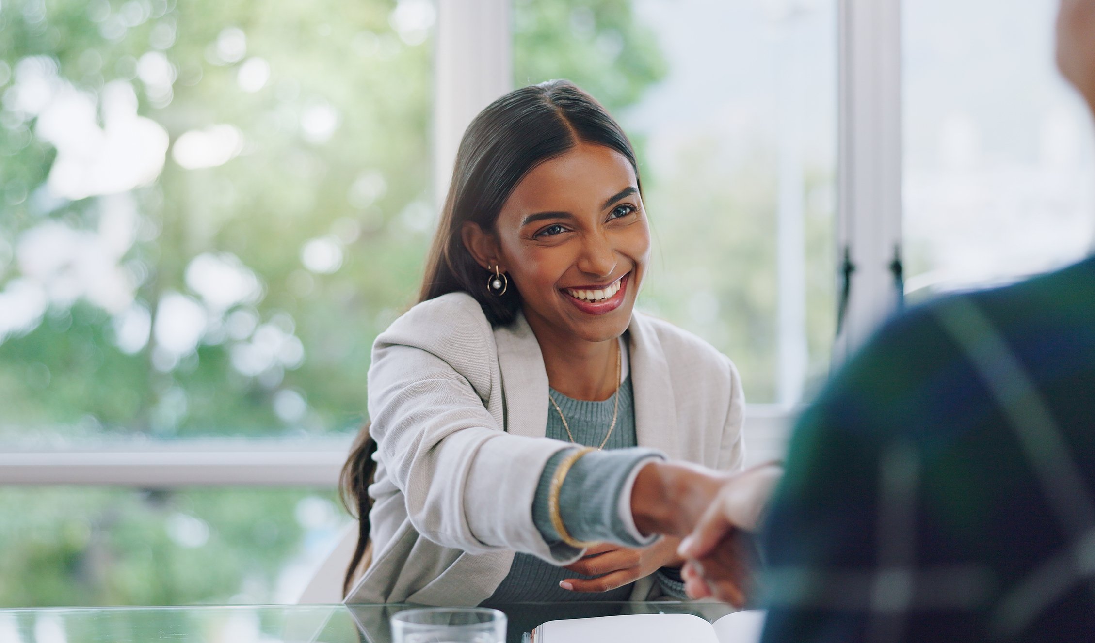 Business woman handshake during interview 