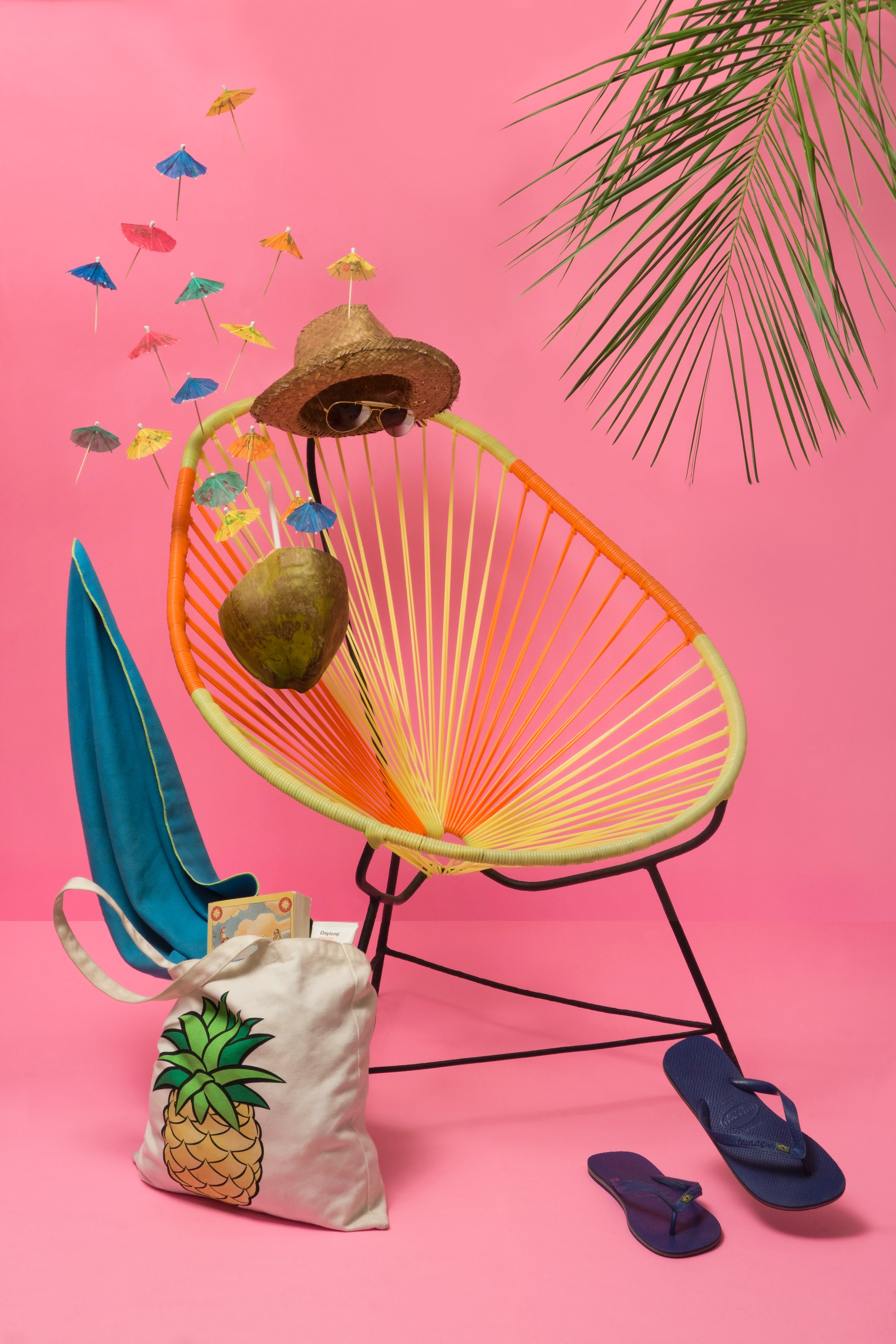 PRT Staffing Tips for Finding a Summer Job Pink Background Palm Tree Straw Hat Beach Bag String Chair